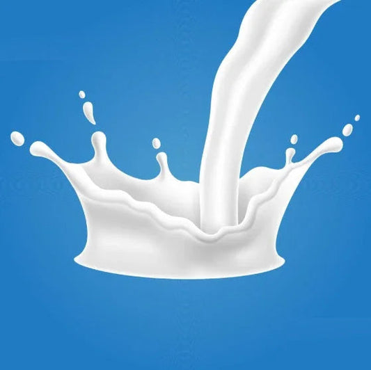 White liquid splash pouring down against a solid blue background